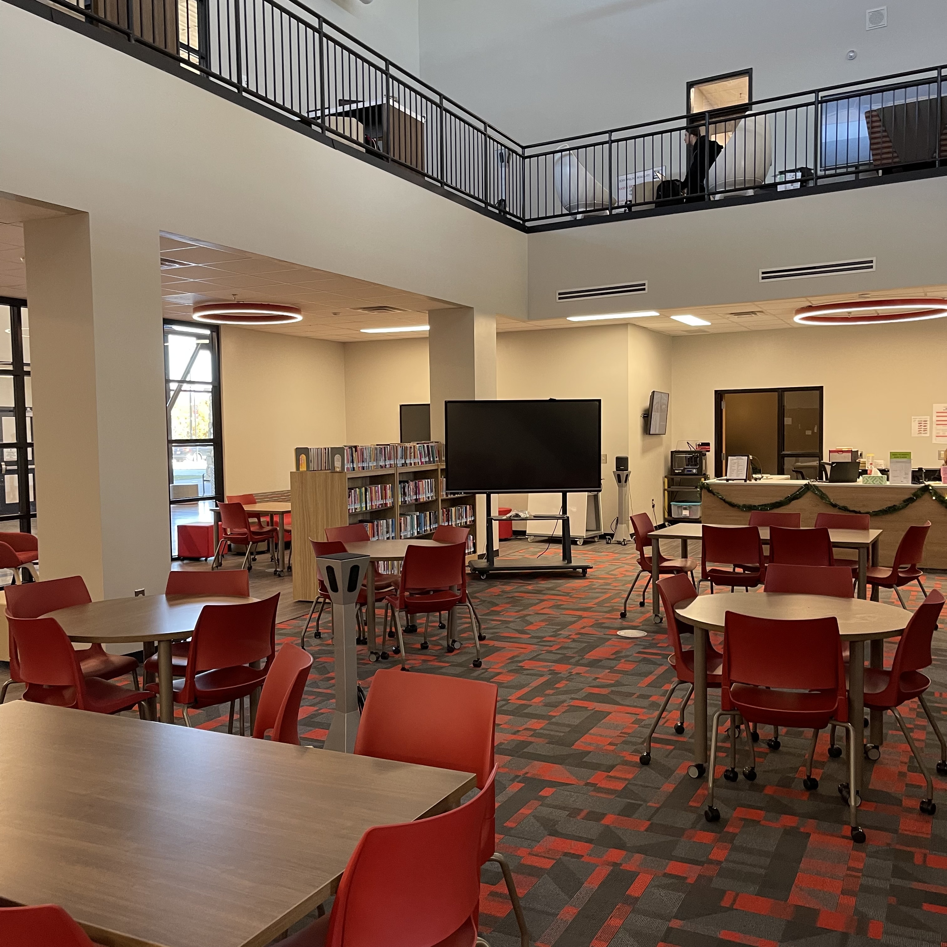 open space with red chairs and tables