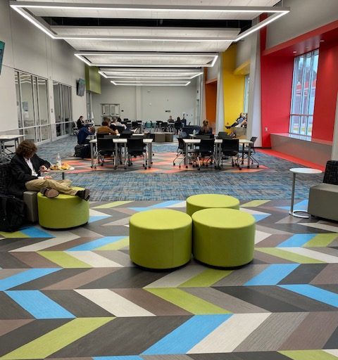 open space with assorted green tables